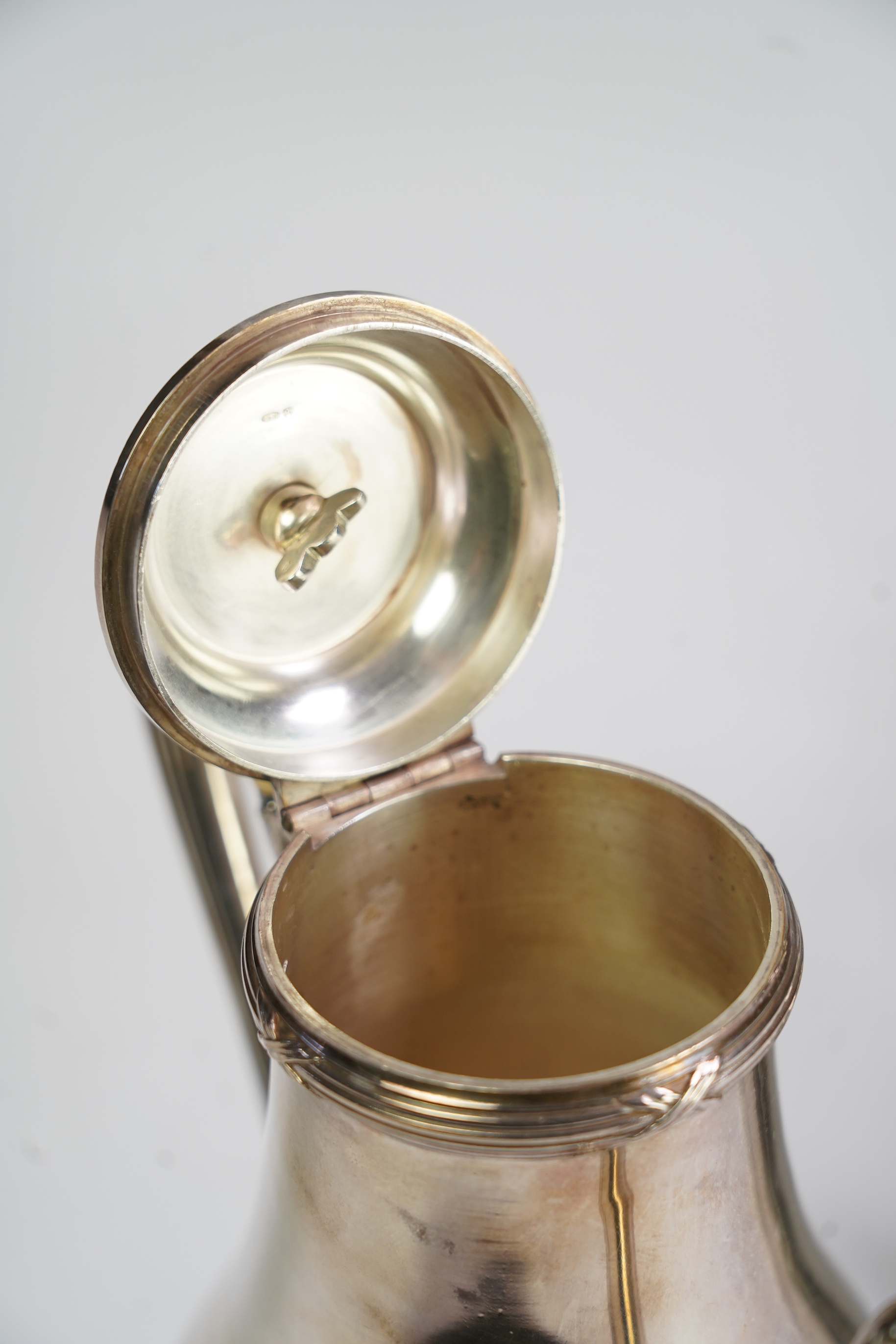 An early 20th century French silver three piece tea and coffee set, comprising a teapot, coffee pot and two handled sugar bowl, by Henin & Cie
